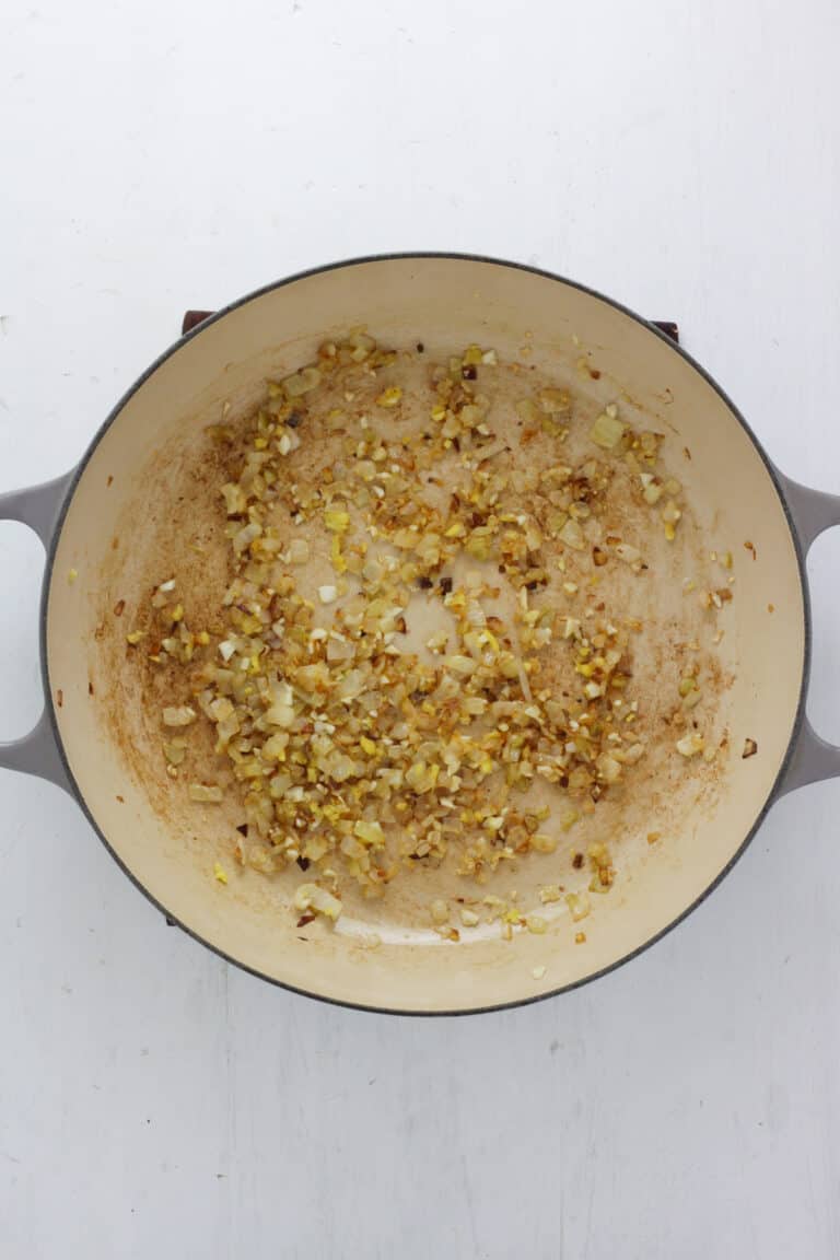 Braiser pan with chopped caramelized onions.