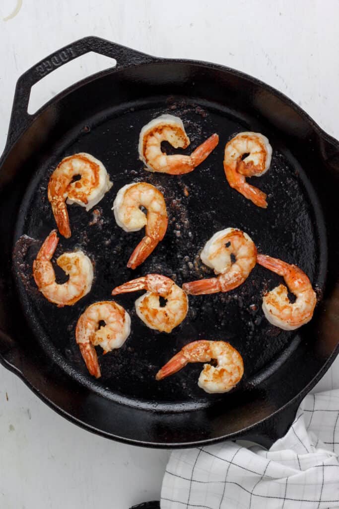 skillet with seared shrimp