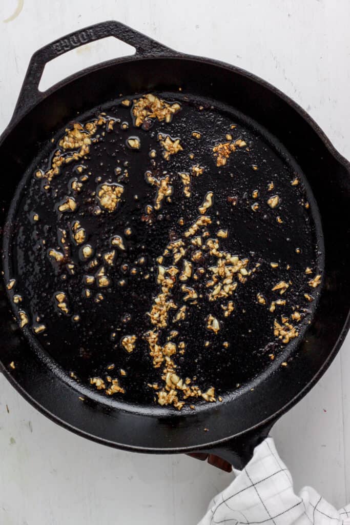 Skillet with minced garlic cooked.