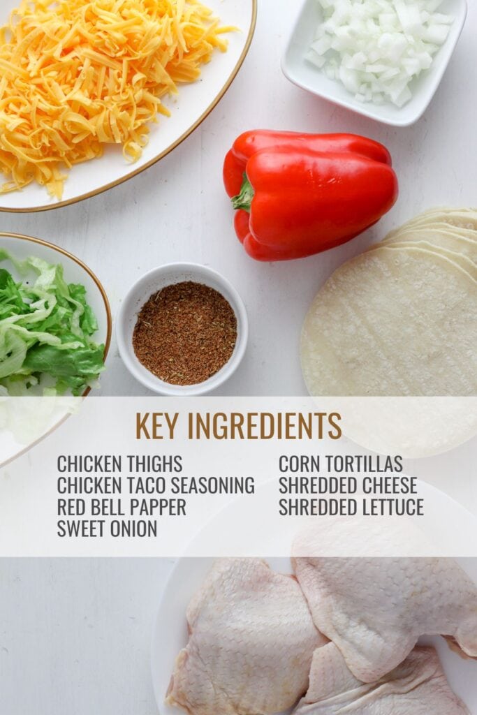 A rustic table with ingredients for crispy chicken tacos.