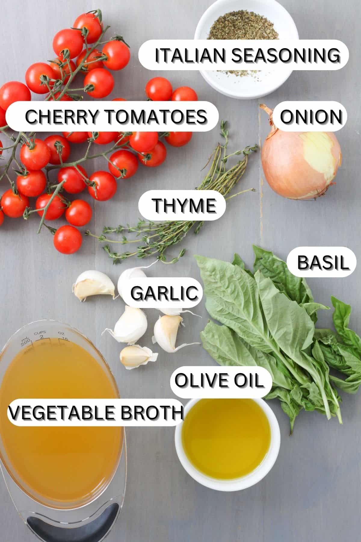 Ingredients for cherry tomato soup on a table.