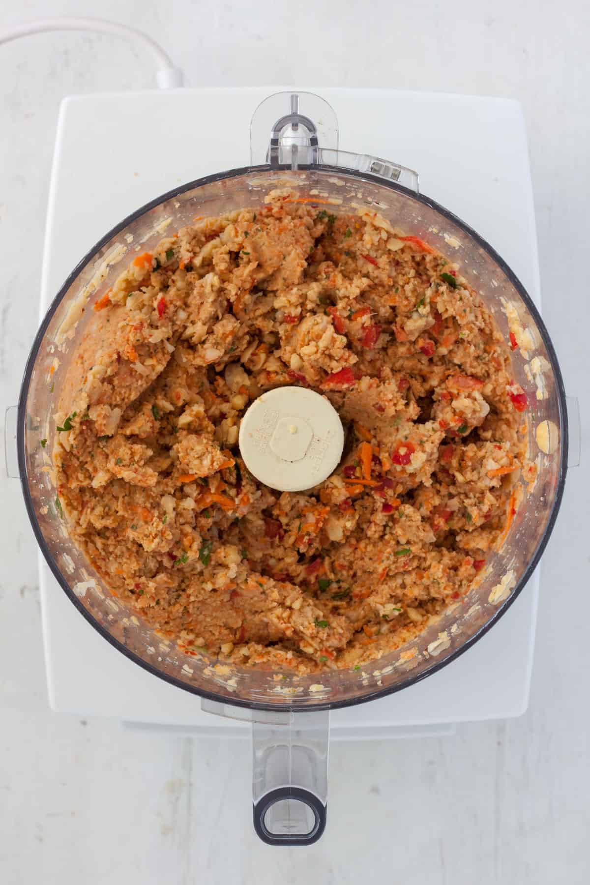 Chickpea patty batter in the base of a food processor.