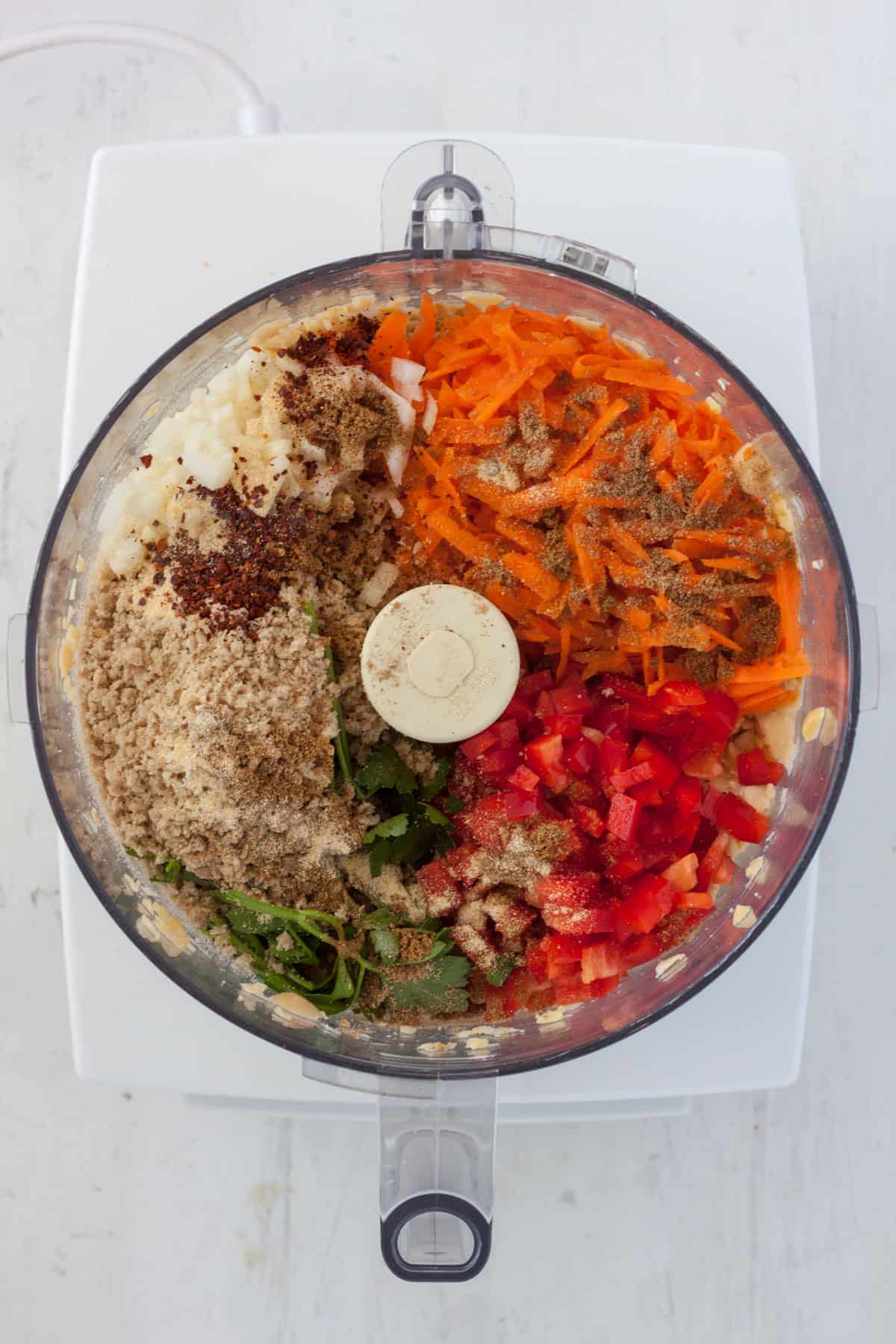 Ingredients for chickpea fritters in a food processor.