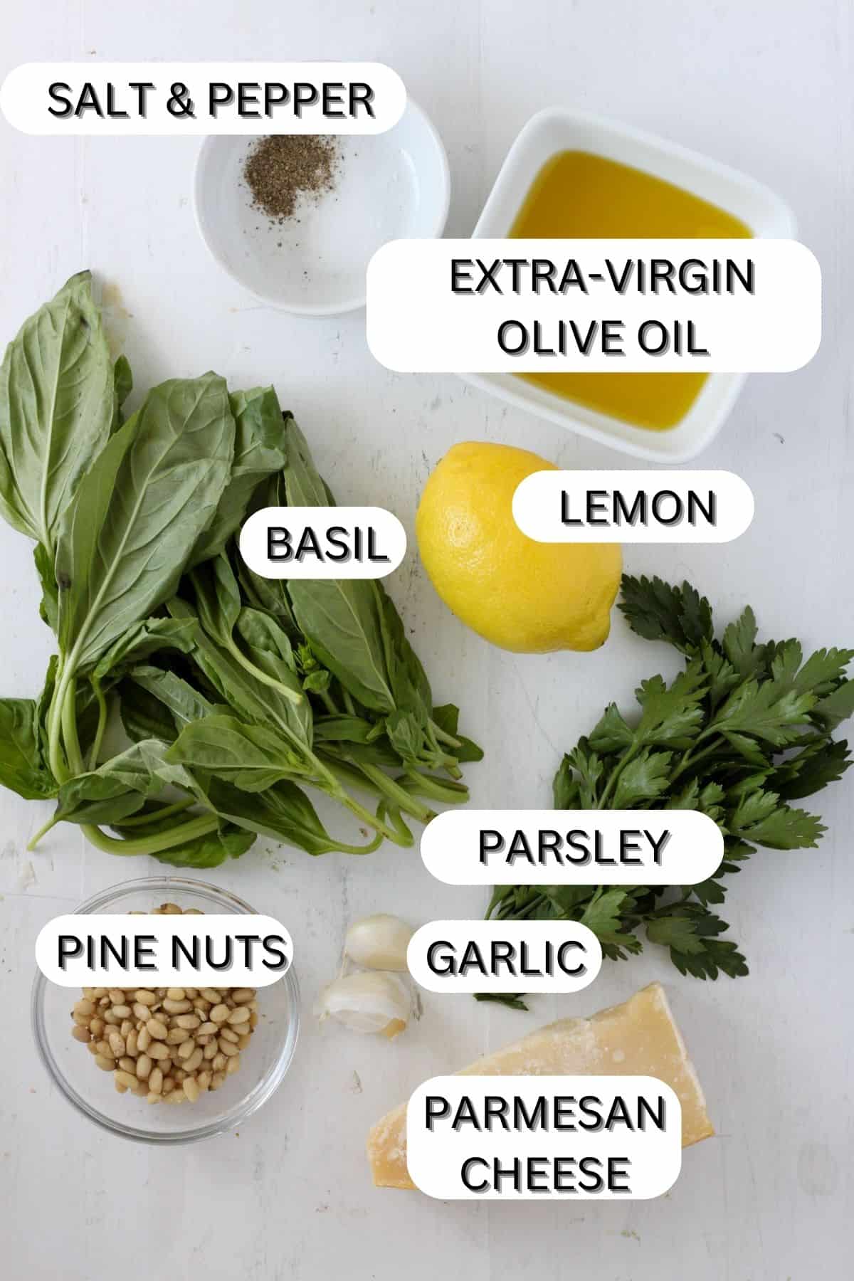 Ingredients for homemade basil pesto on a table.