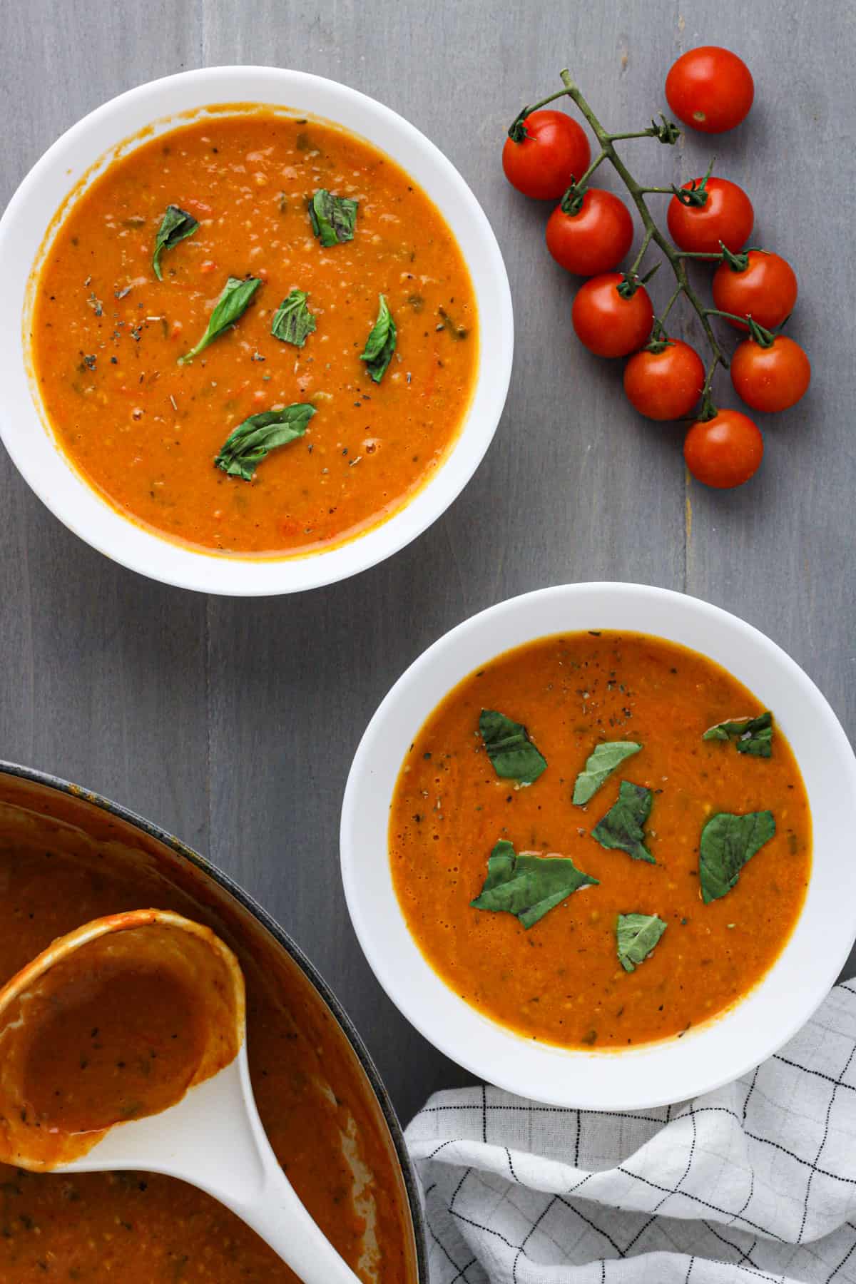 Two bowls of cherry tomato soup.
