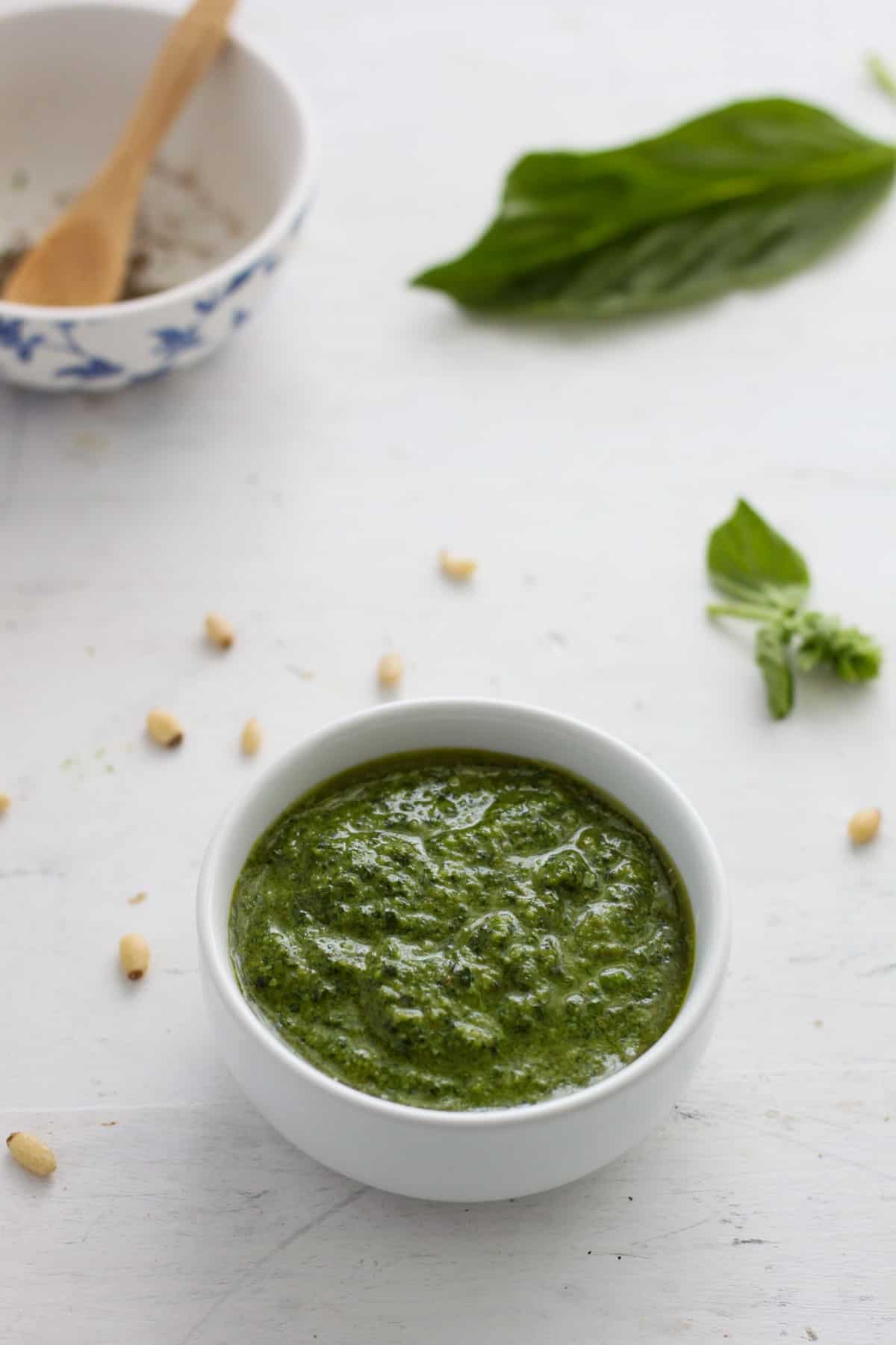 A small bowl of homemade basil pesto.