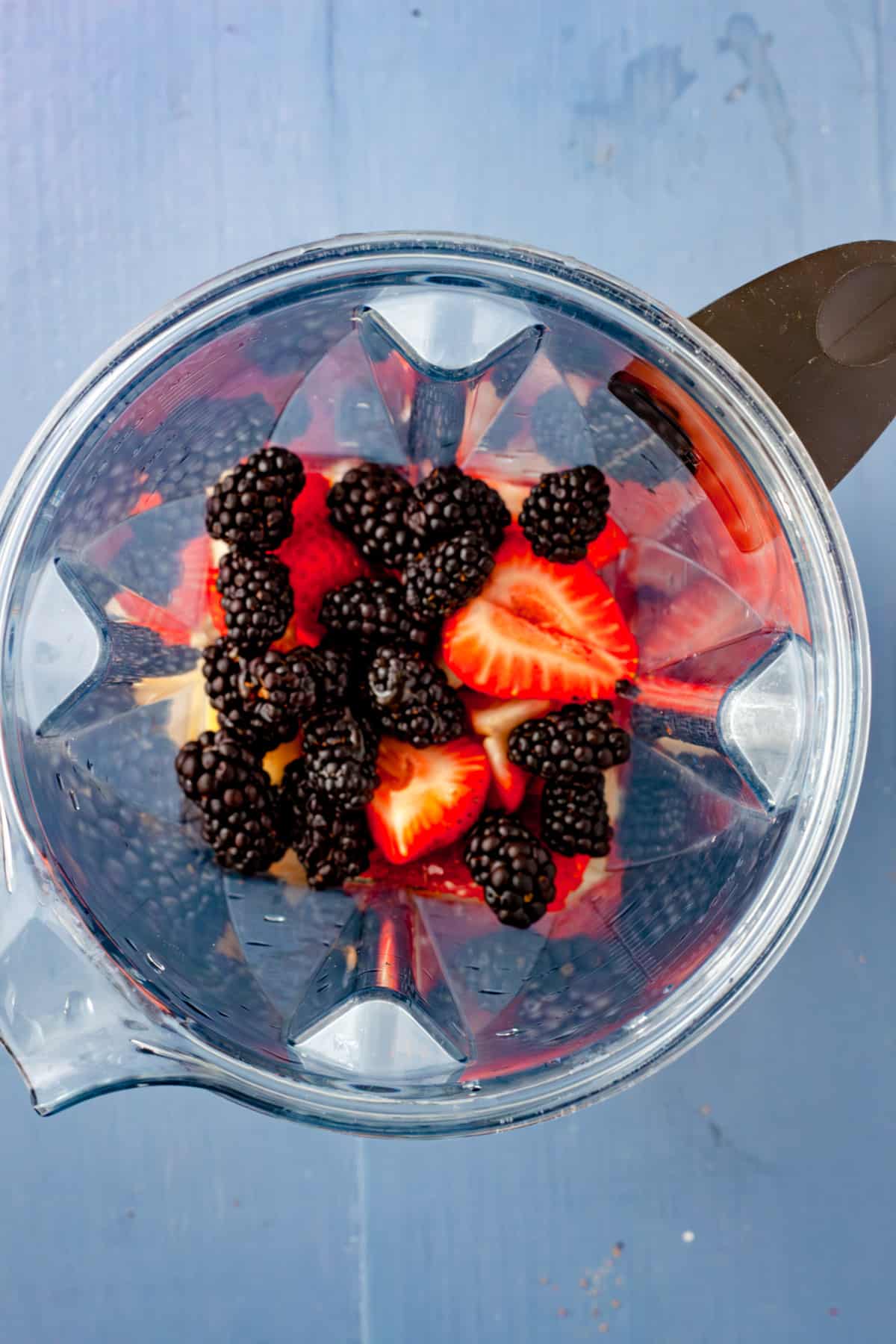 Mixed berries in a blender, unblended.