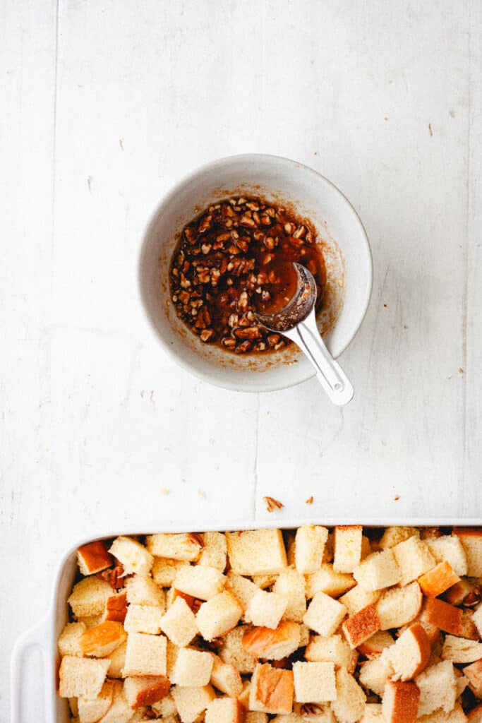A small bowl with pecan and brown sugar topping for a brioche french toast casserole.