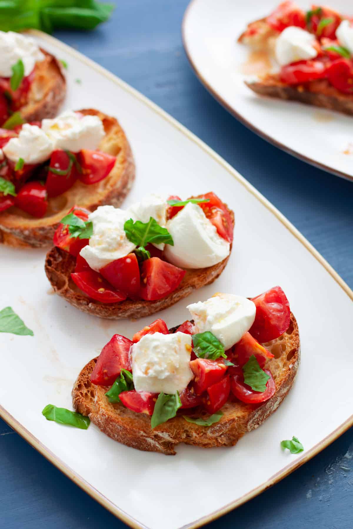 A platter of burrata bruschetta.