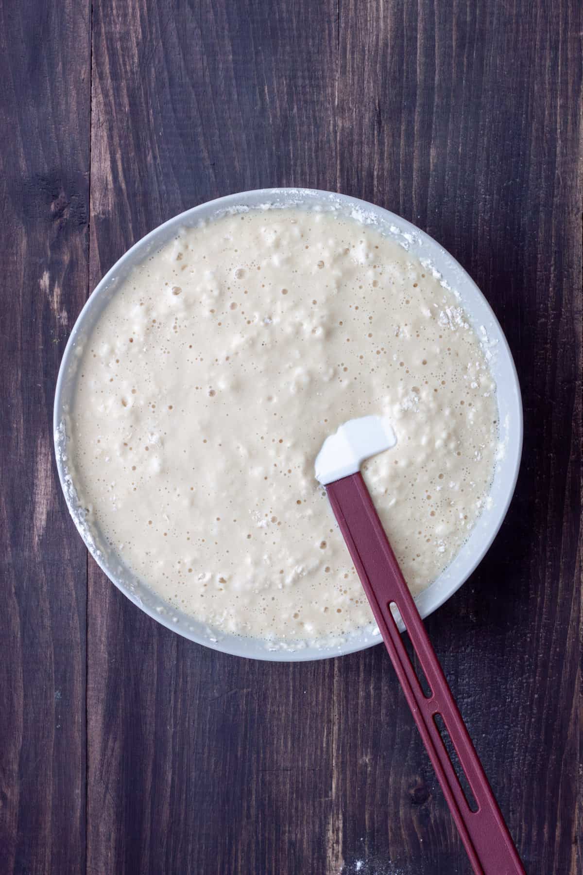 Oat milk pancake batter in a medium mixing bowl.