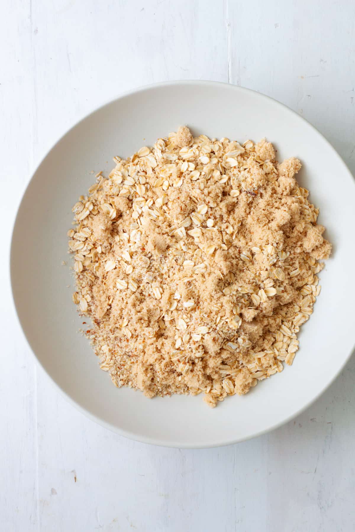 Oats and ground almonds in a mixing bowl.