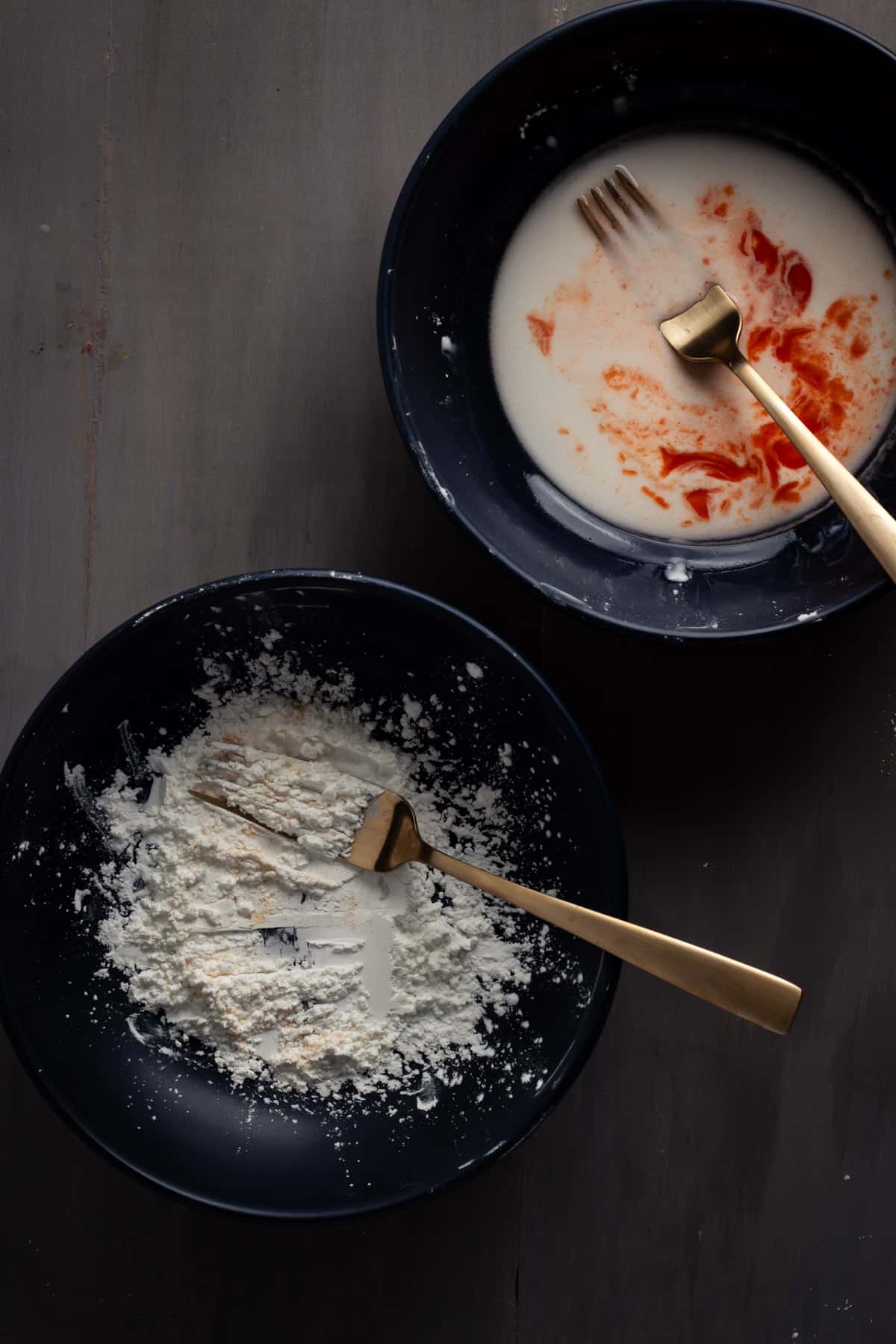 Dry and wet ingredients in small bowls for crispy buffalo tofu.