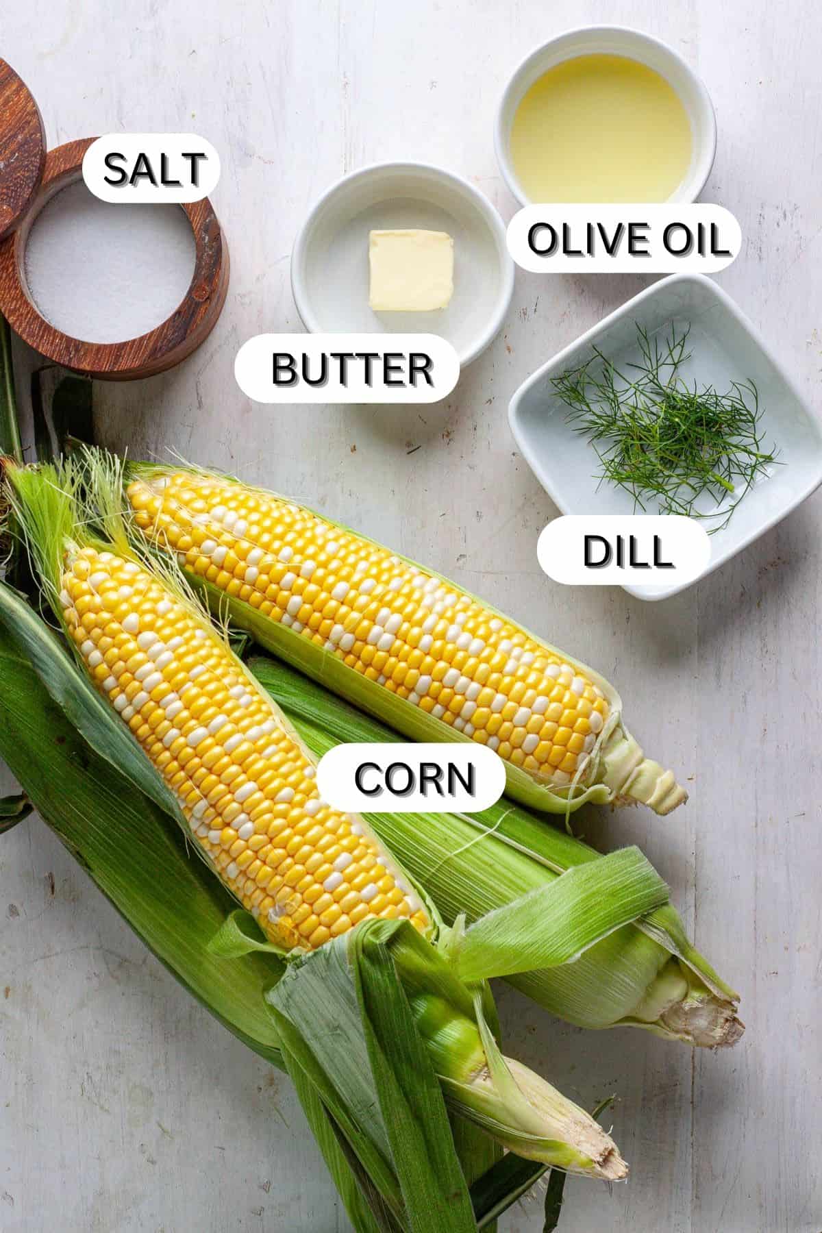 Ingredients for charred corn on a white table.