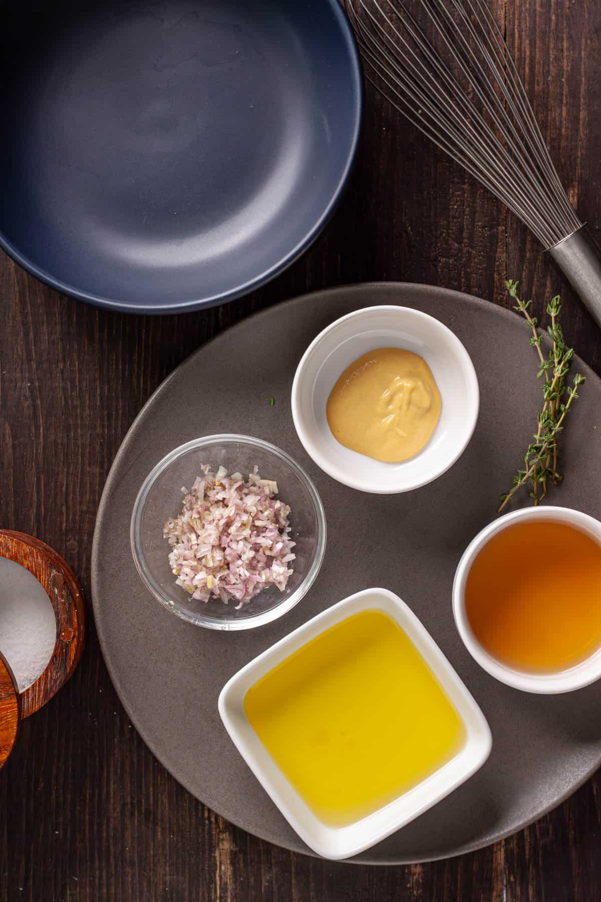 Ingredients for a white balsamic vinaigrette on a plate.