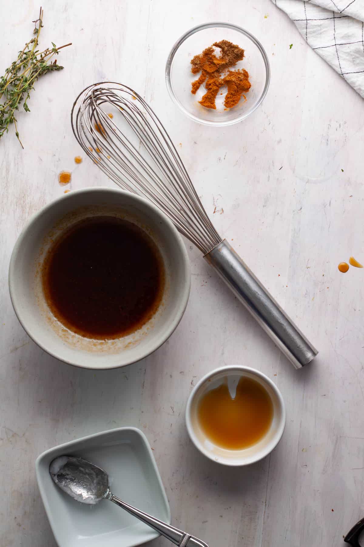 Maple syrup, coconut oil, cinnamon and coriander whisked together in a small bowl.