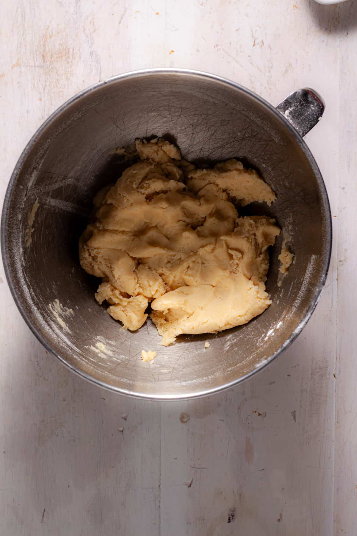 A simple cookie pie crust in a mixing bowl.