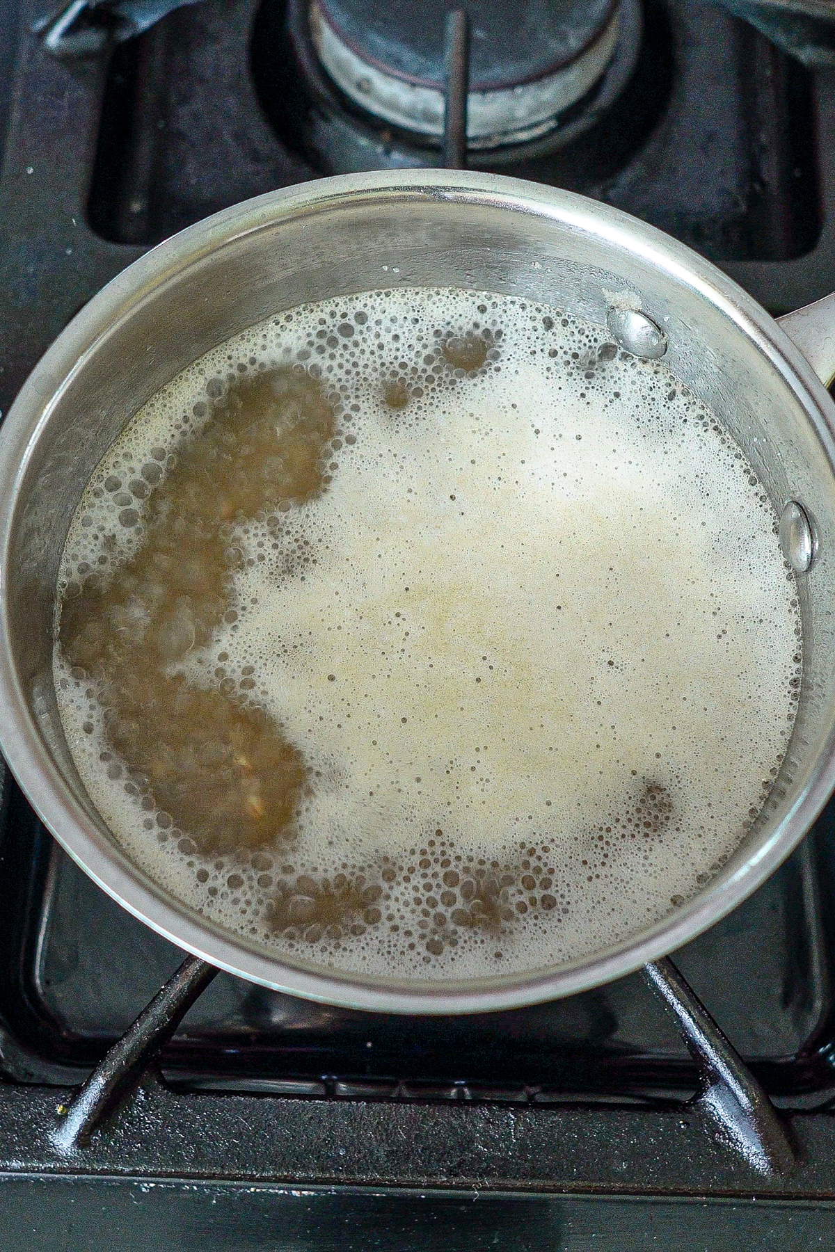 Farro simmering in a small saucepan.