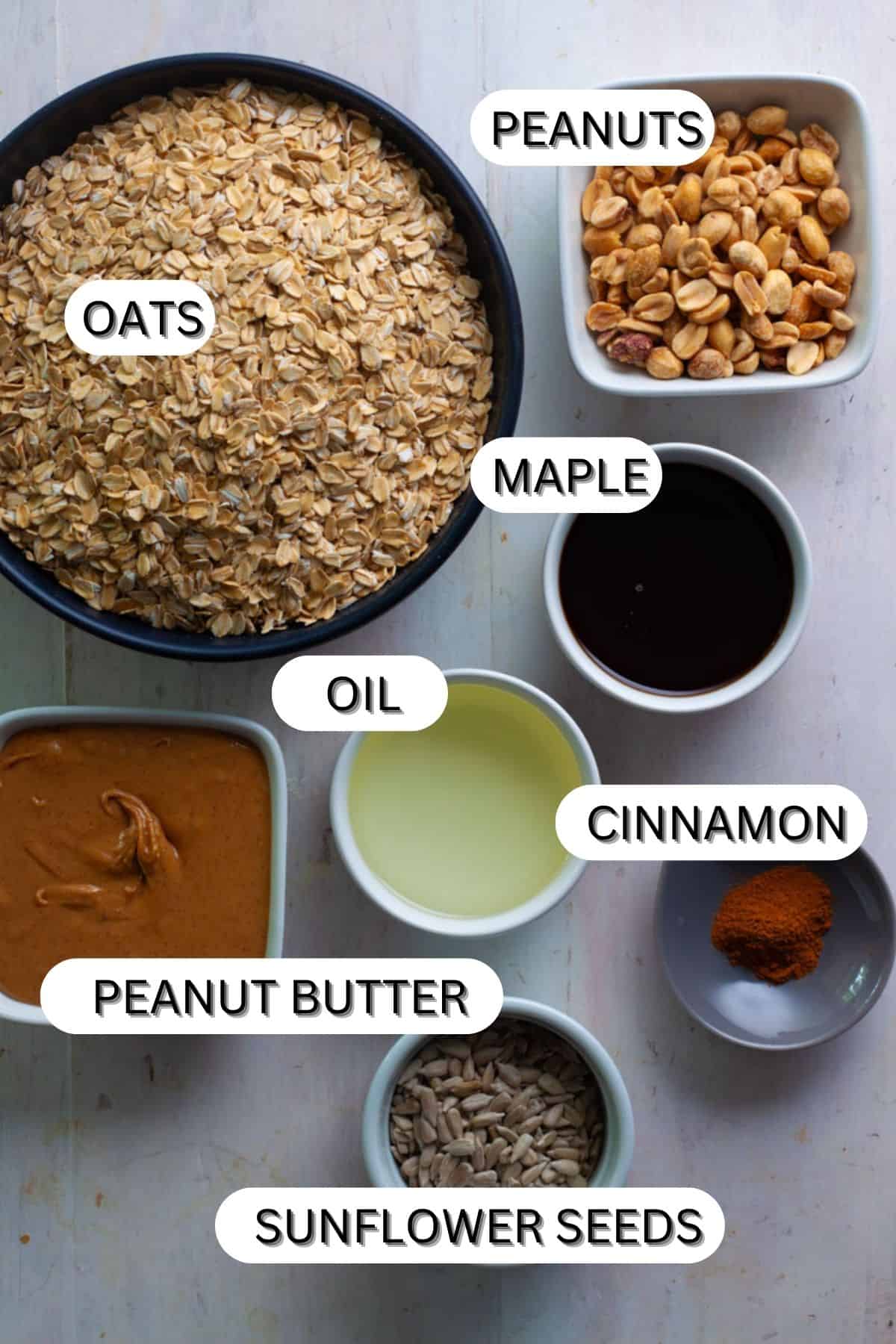Peanut butter granola ingredients on a white table.