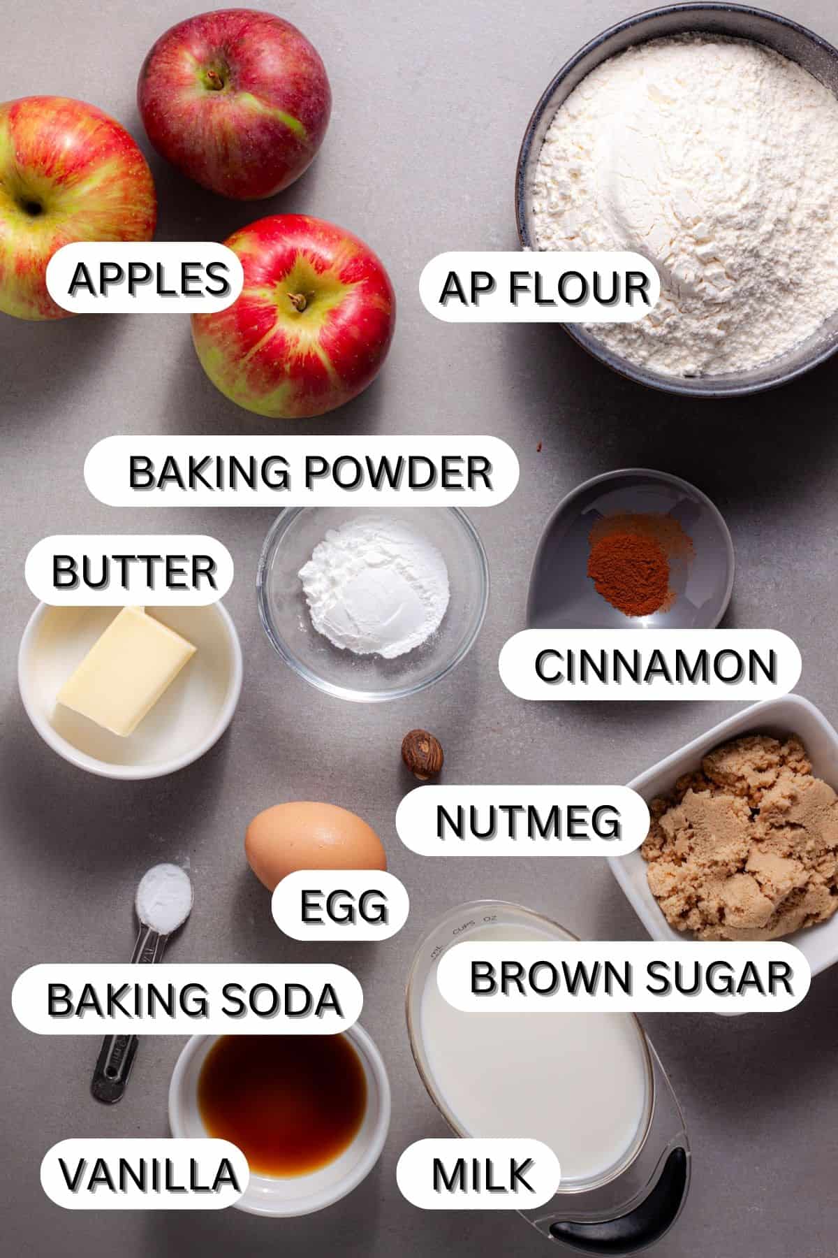 Ingredients for brown butter apple pancakes on a gray table.