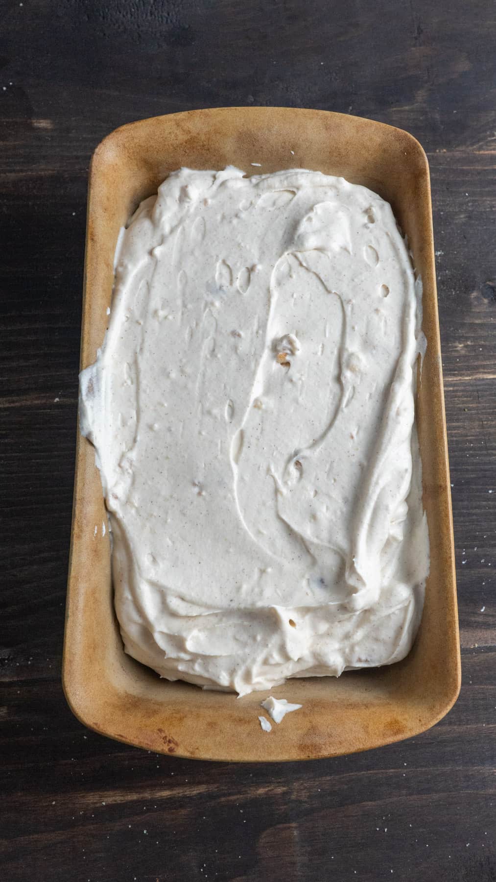 No-churn cider donut ice cream in a loaf pan ready to get frozen.