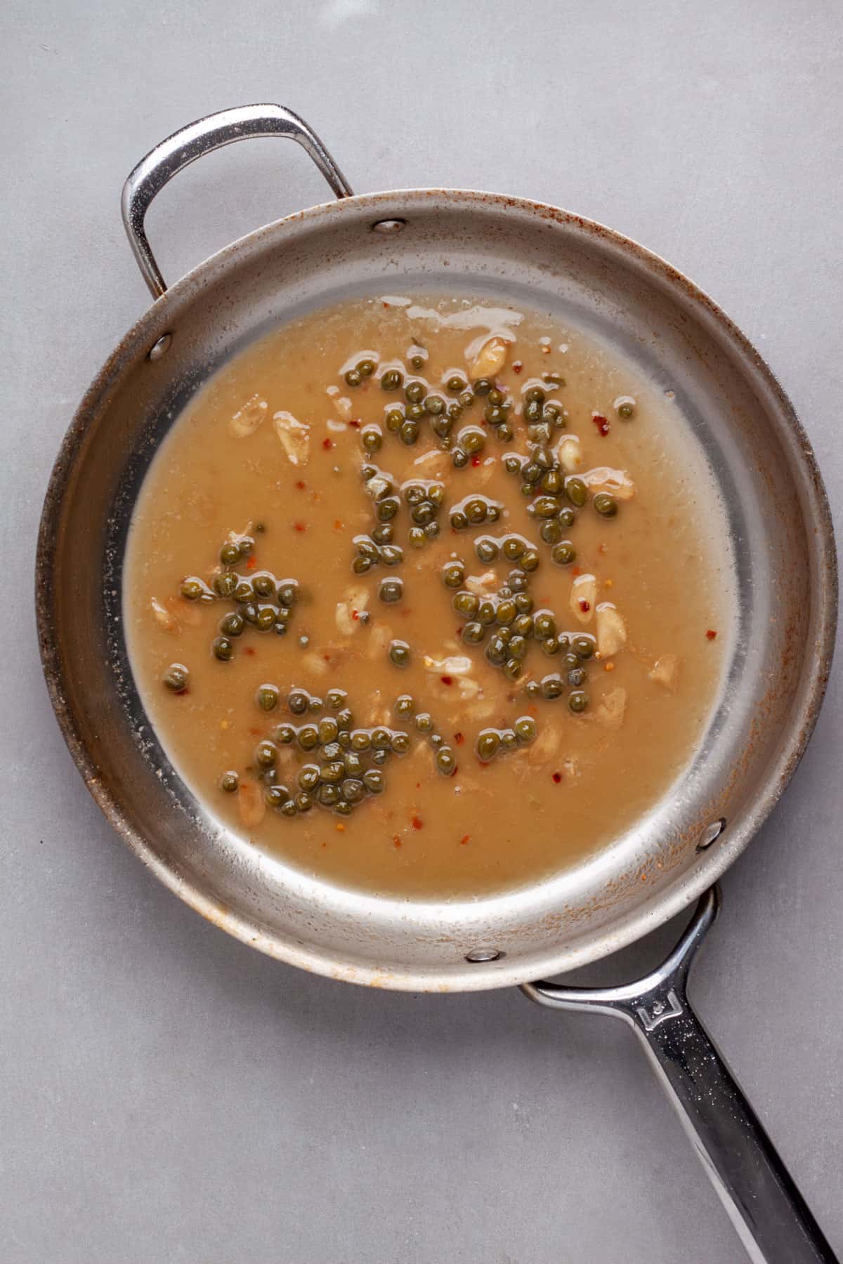 A skillet pan sauce of lemon, capers, garlic and white wine.