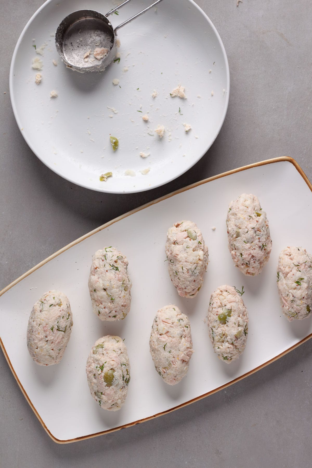 Tuna croquettes uncooked ready to dip in egg and breadcrumbs.