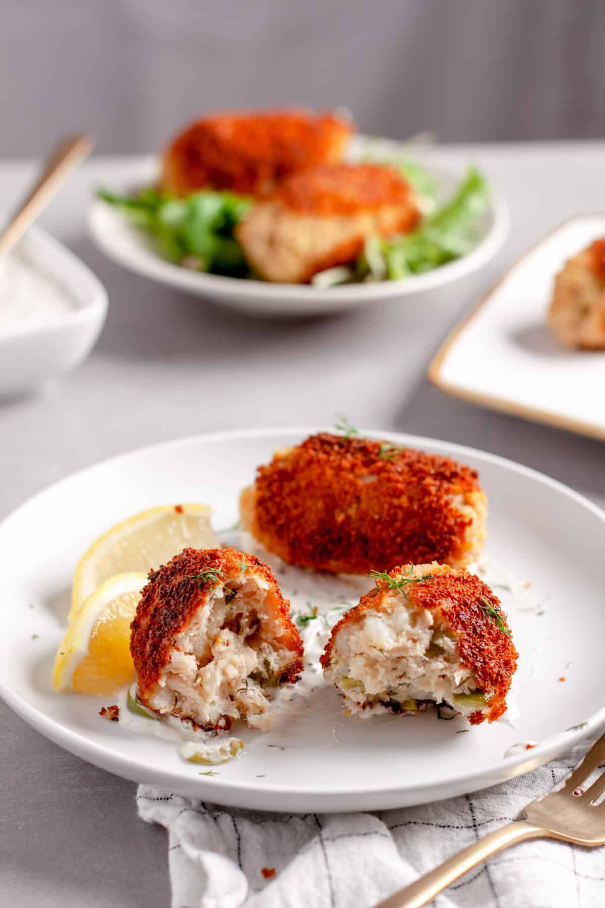 A tuna croquette cut in half to show the interior.