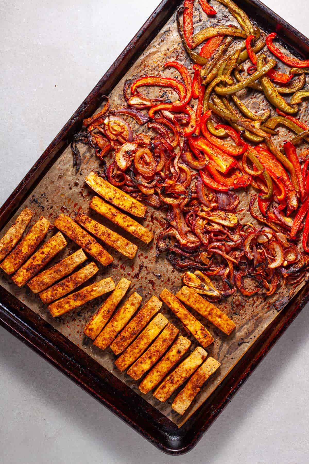 A sheet pan with tofu fajitas right out of the oven.