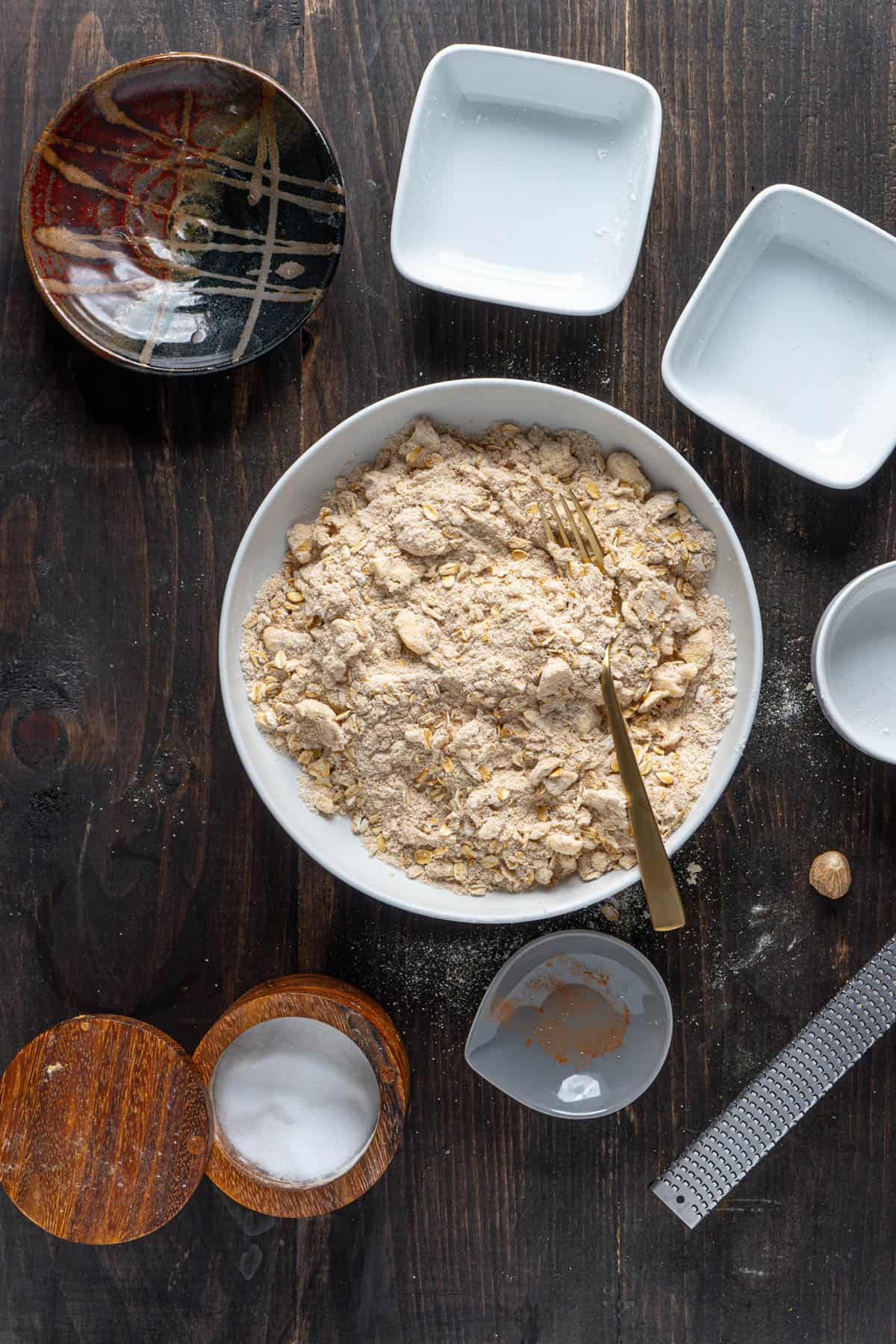 An oat and brown sugar streusel in a bowl ready for a gluten-free apple crisp.