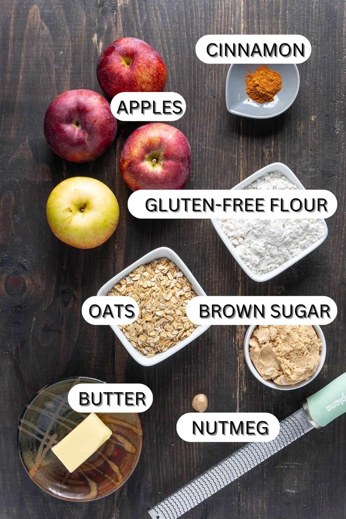 Ingredients for a gluten-free apple crisp on a dark table.