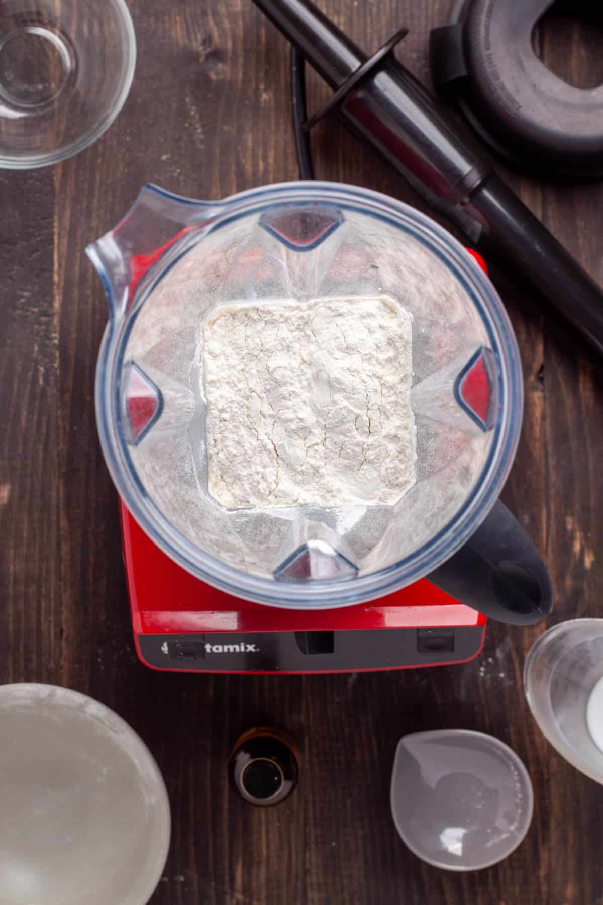 Ingredients for a Dutch baby batter in a food processor.