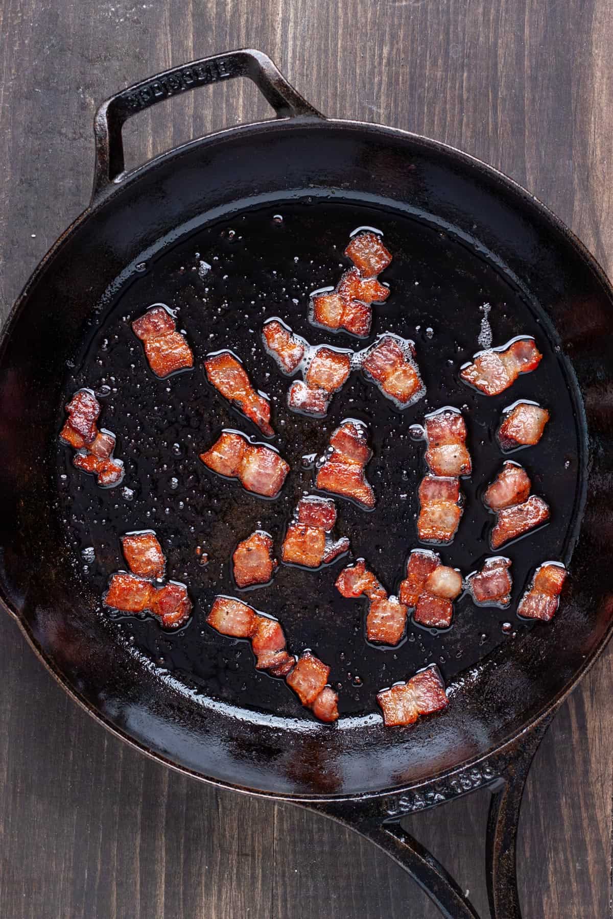 Cooked bacon in a cast iron skillet.
