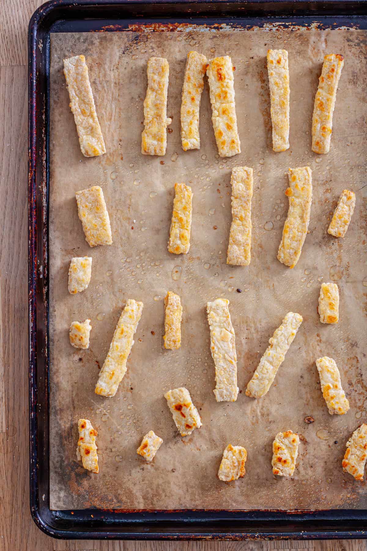 Crispy oven-roasted tofu strips ready for tofu wraps.