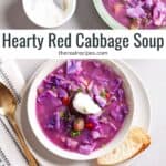 A couple servings of hearty red cabbage soup, one topped with sour cream and fresh herbs.