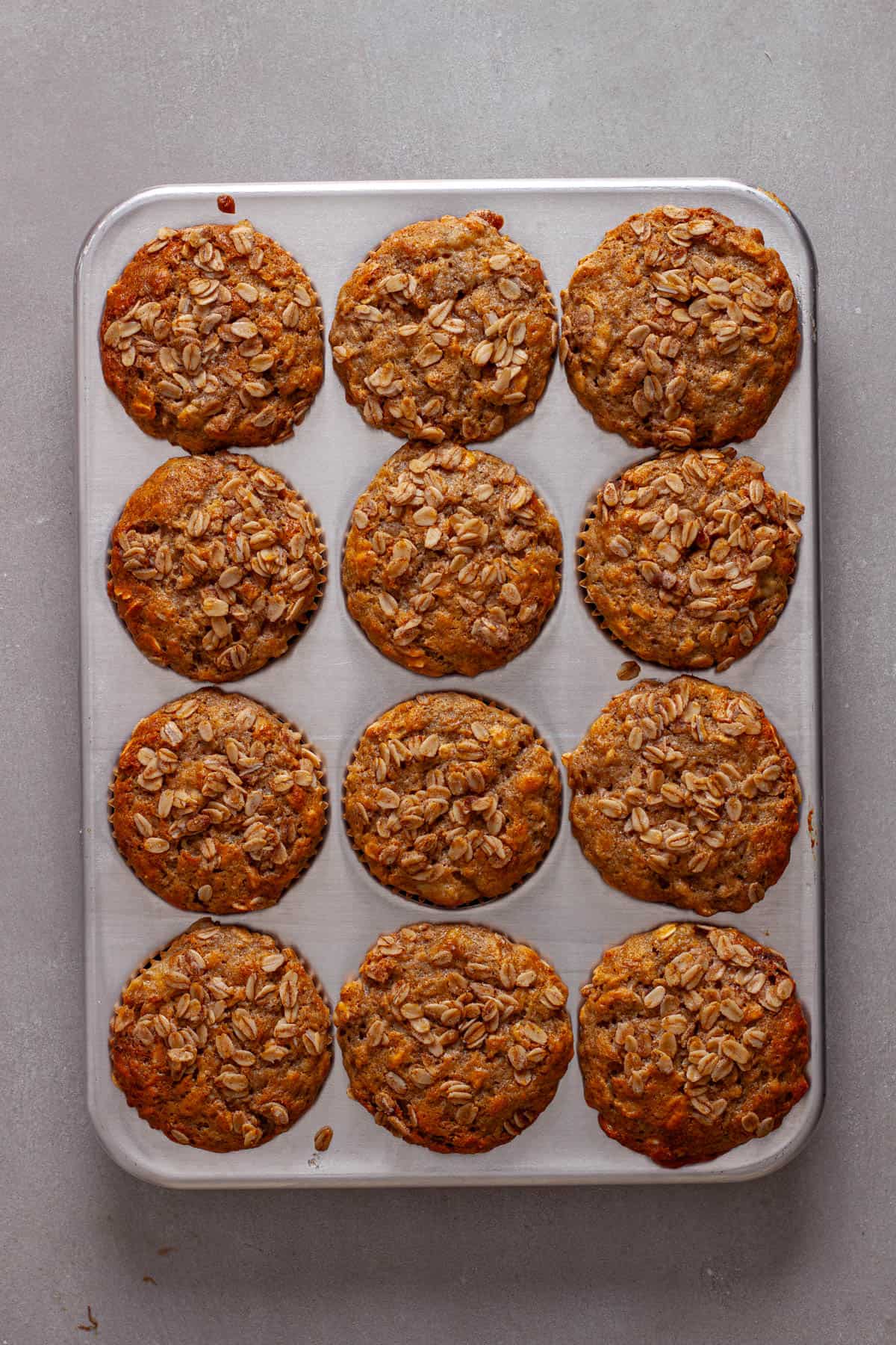 Cooked banana oat muffins in a muffin tin right out of the oven.