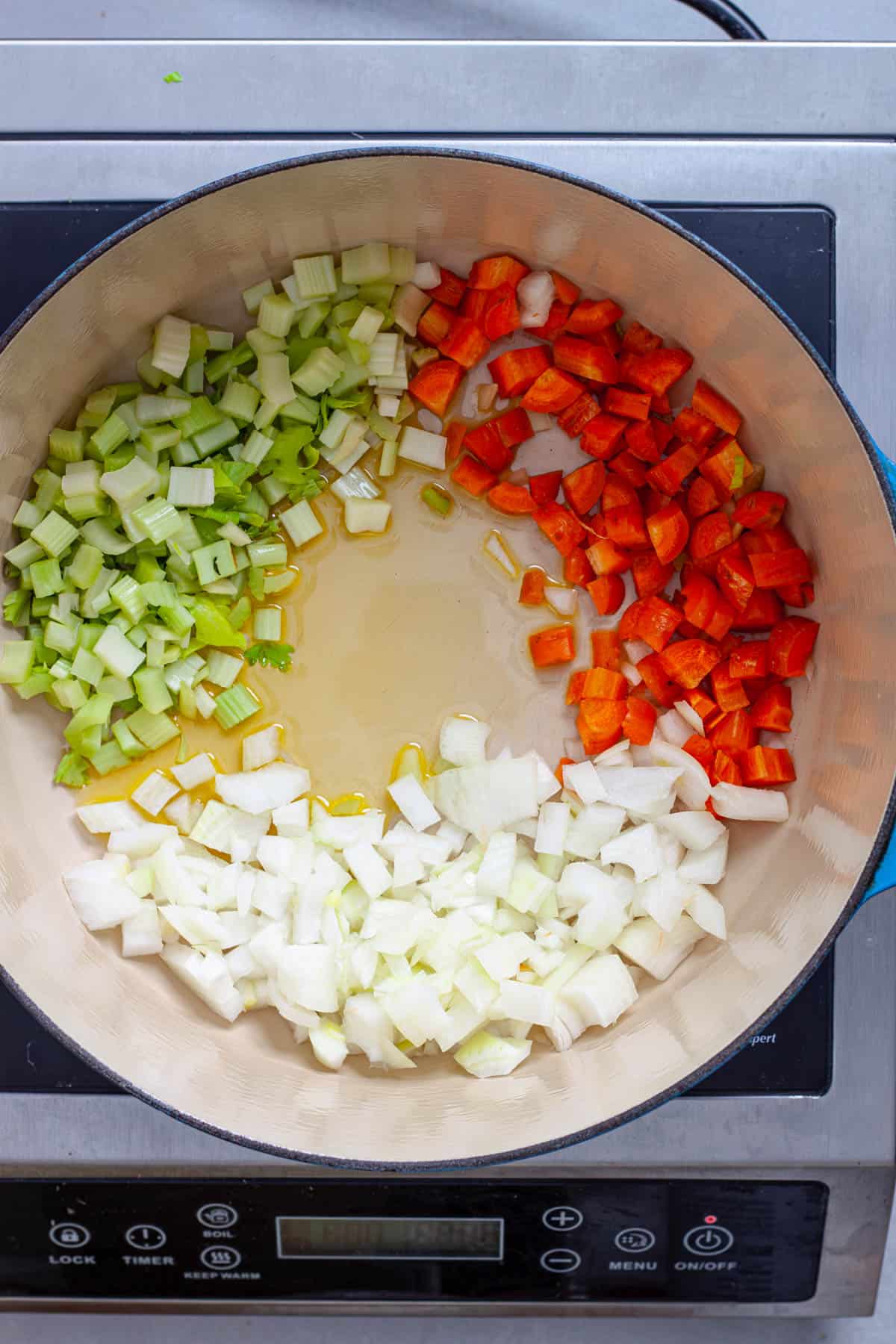 Onion, celery and carrots in a large Dutch oven.