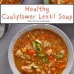 A serving of cauliflower lentil soup in a bowl on a gray table.