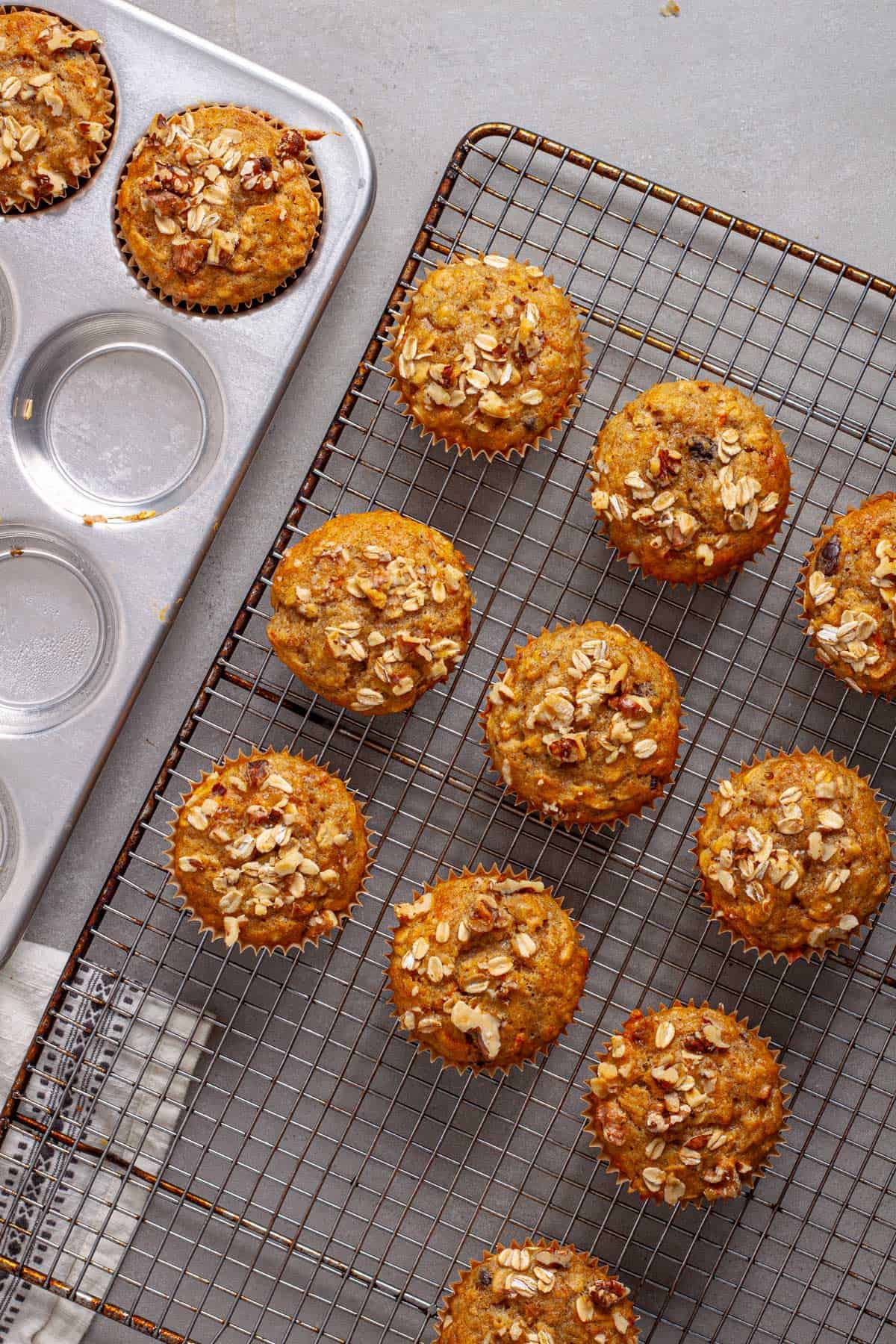 Carrot banana muffins cooling on a wire rack.