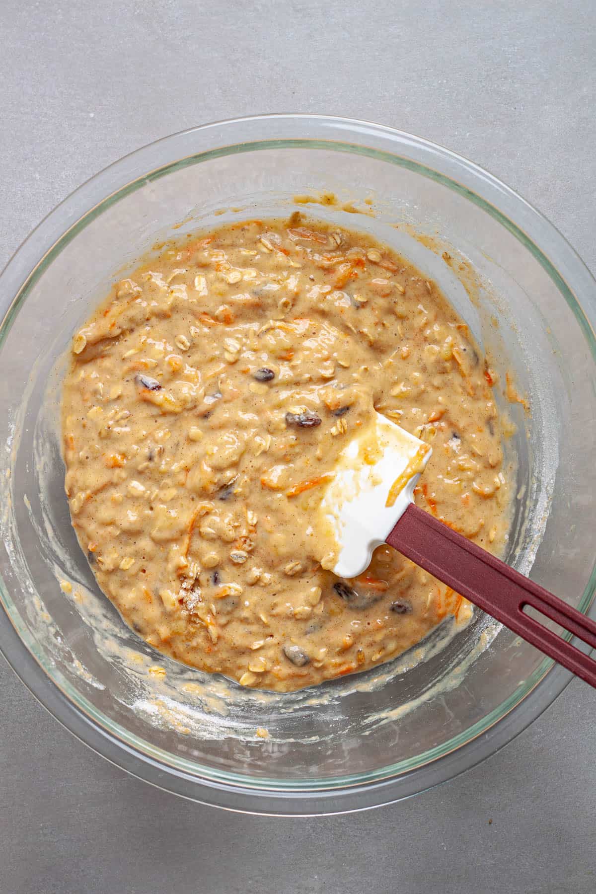 Carrot banana muffin batter mixed together in a large bowl.