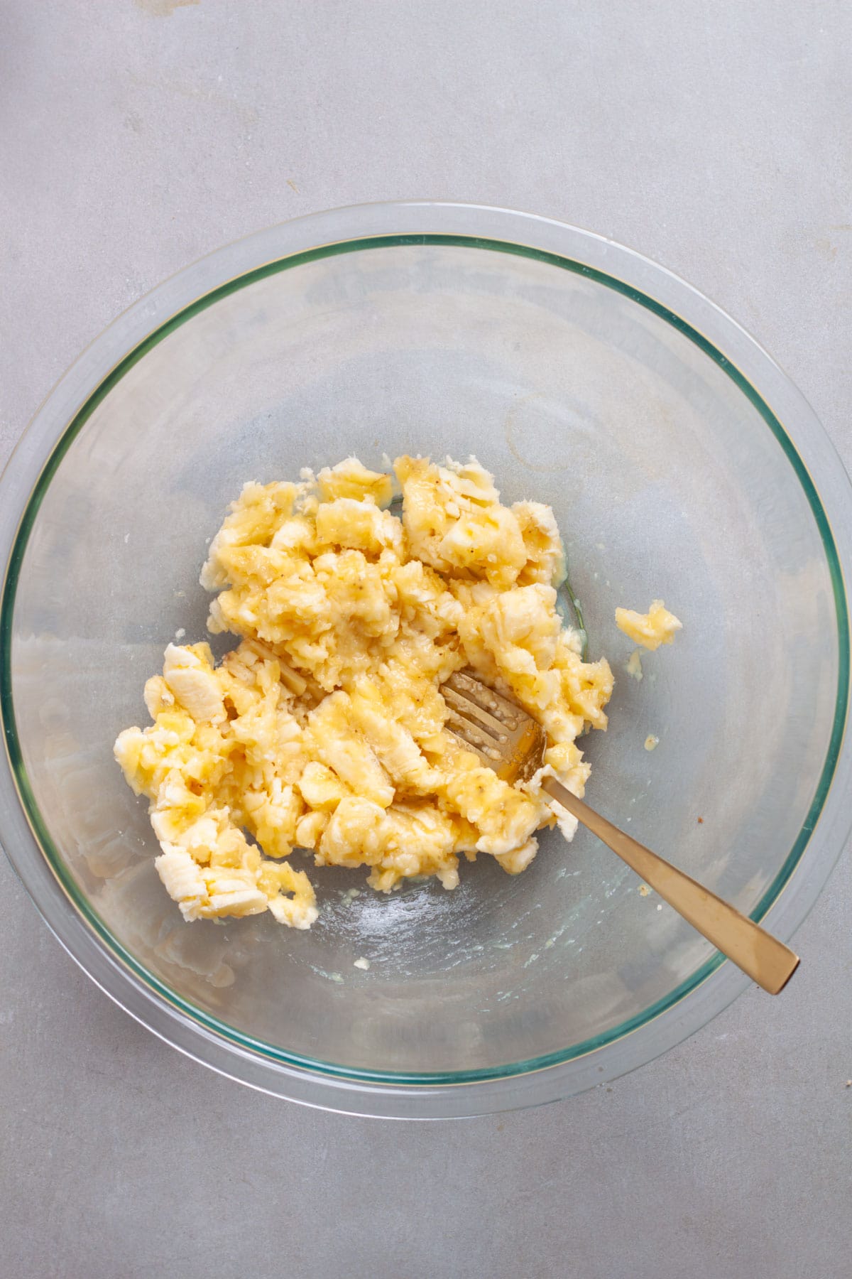 Ripe bananas getting mashed for banana chocolate chunk muffins.