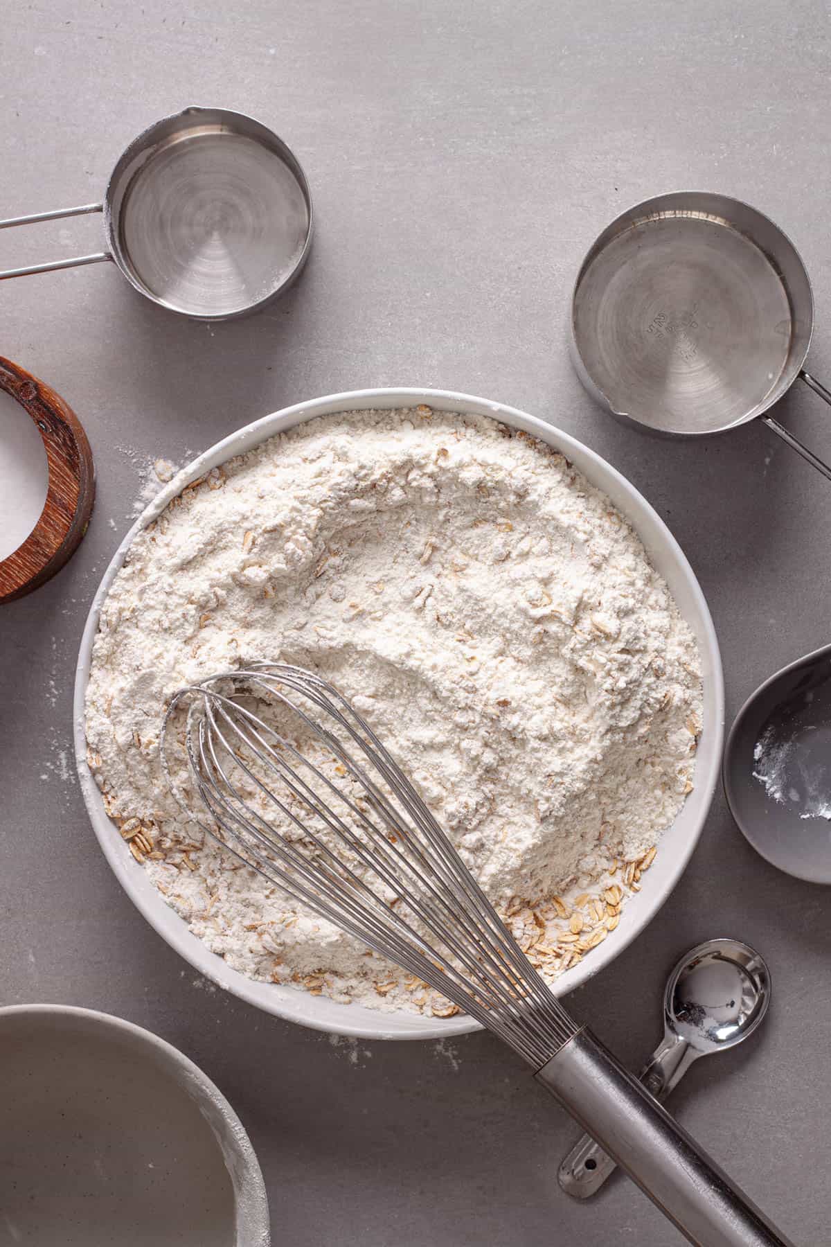 Dry ingredients for blackberry oat muffins whisked together in a medium bowl.