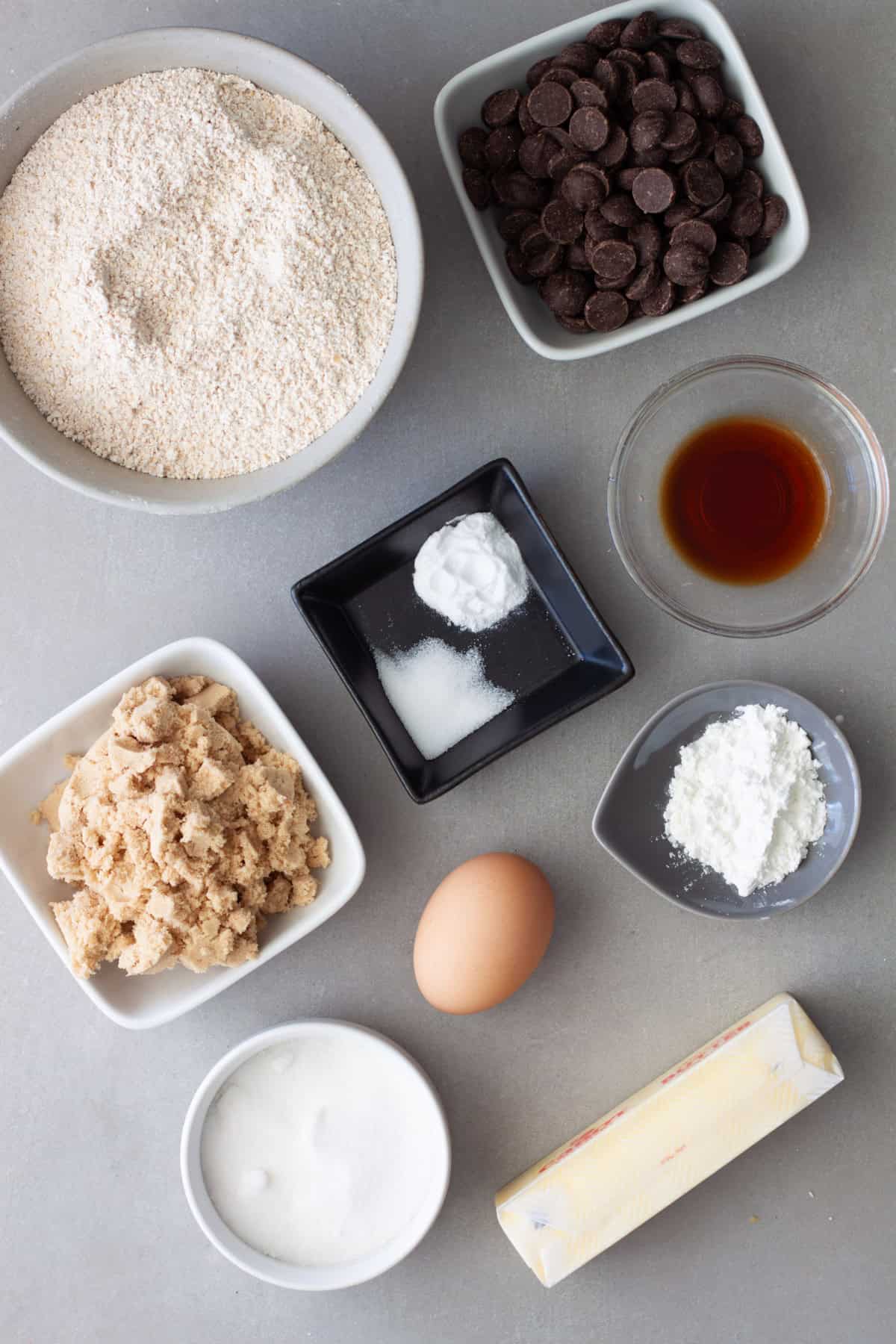Ingredients for oat flour cookies on a gray table.