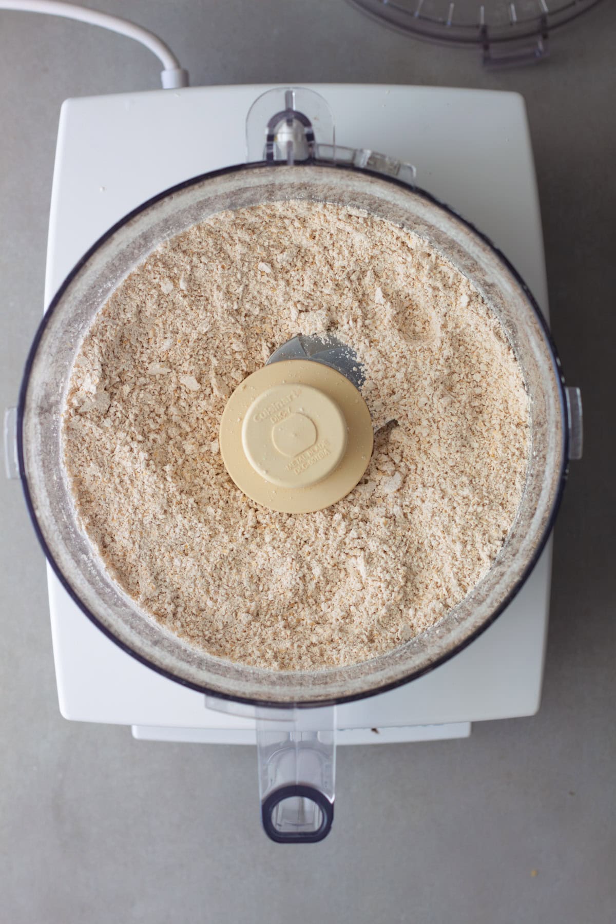 Ground up rolled oats turned into oat flour in a food processor.