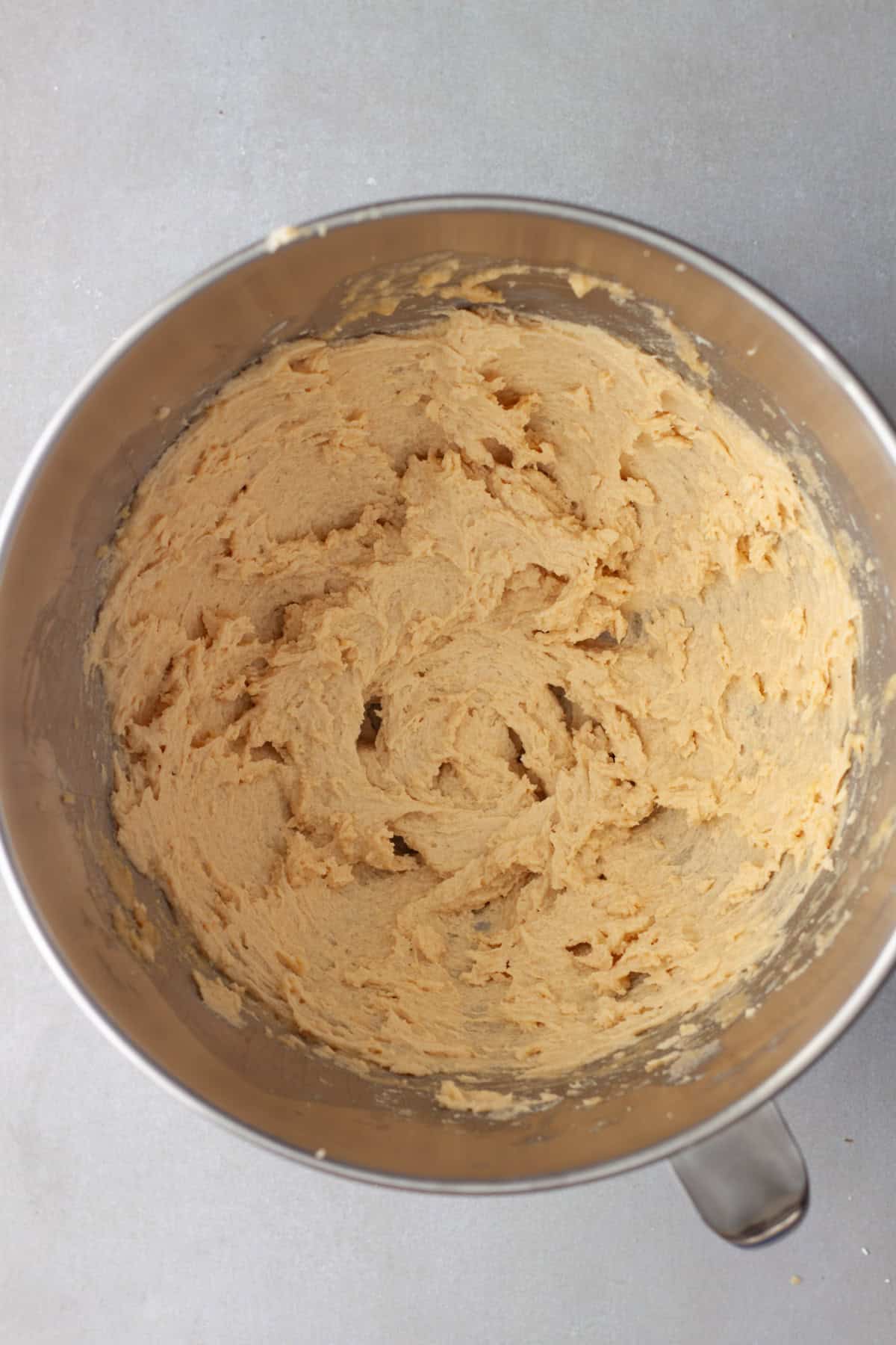 Light and fluffy gluten free cookie base in a mixing bowl.