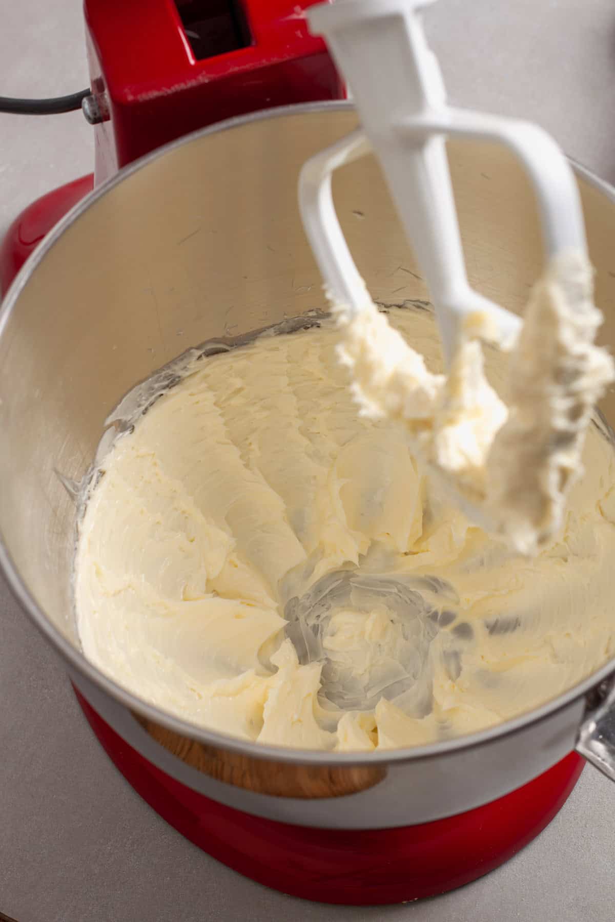 Softened butter getting whipped for homemade oatmeal cookies.
