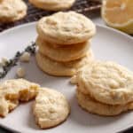 A small stack of lemon and white chocolate chip cookies on a plate.