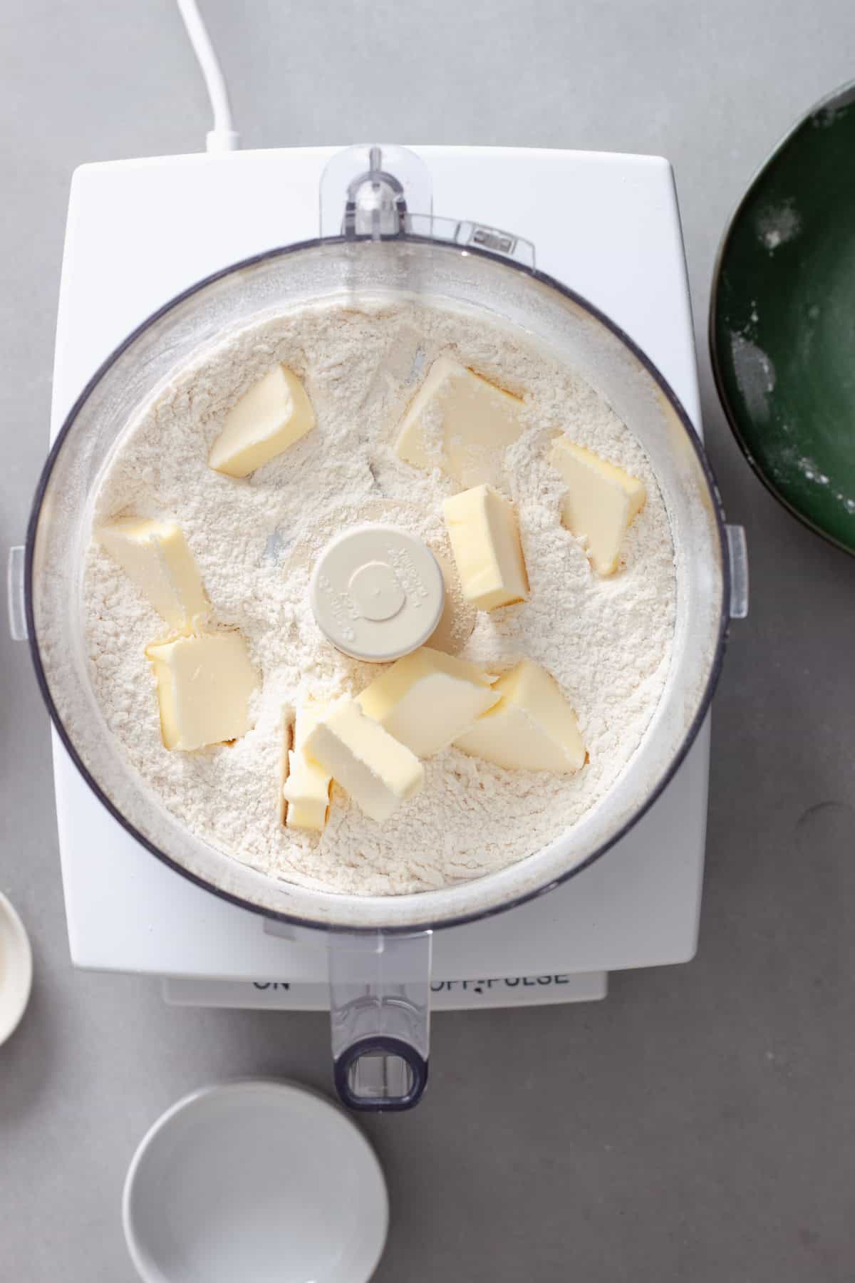 A homemade pie dough getting mixed together in a food processor.