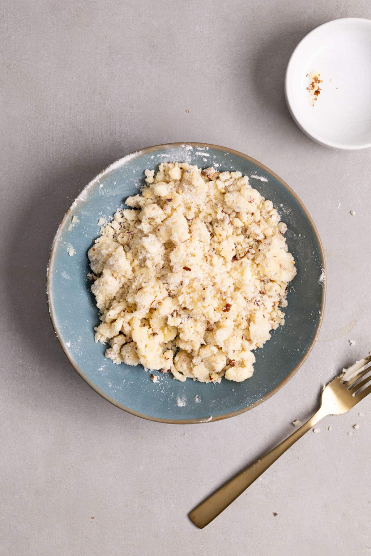 A small bowl with a hazelnut streusel topping .