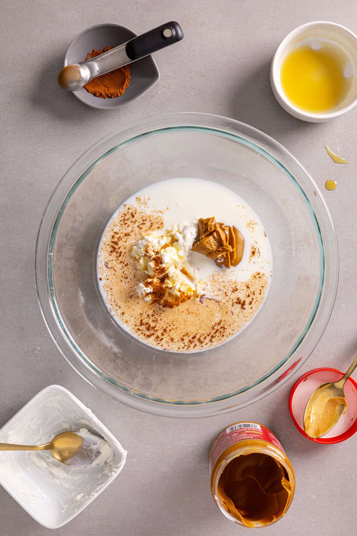 A bowl with yogurt, cookie butter, milk and more for overnight oats.