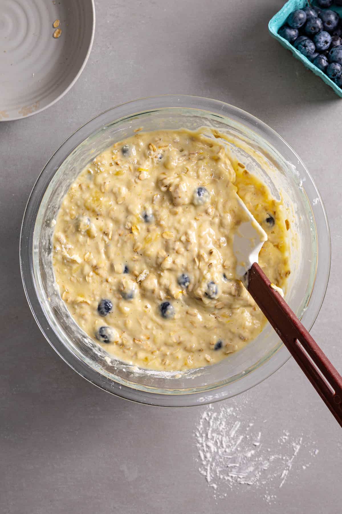 Muffin batter mixed together in a medium bowl.